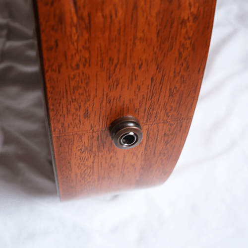 The input jack on an acoustic-electric ukulele